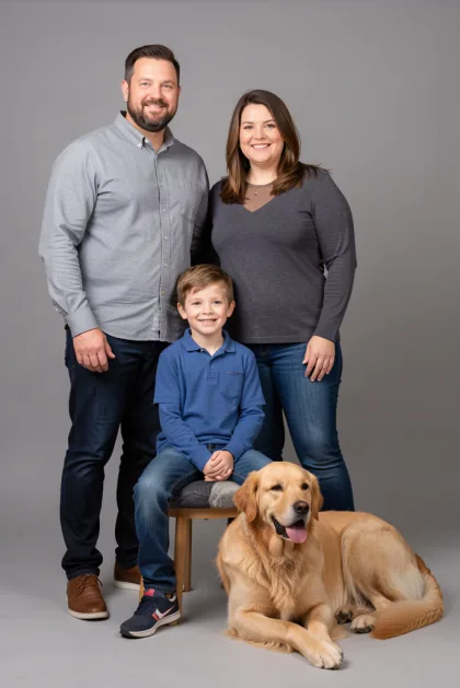 Family photo with a golden retriever